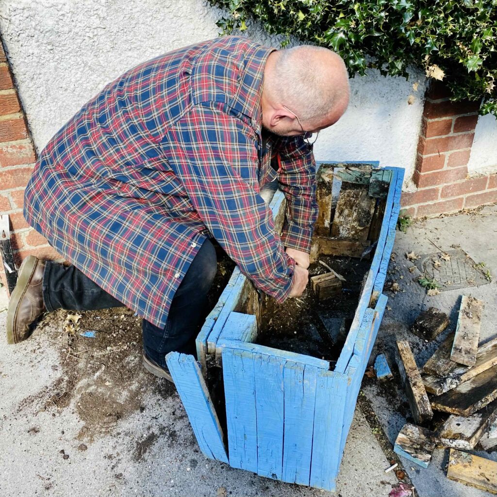 Graham Mitchell dismantling aa blue planter